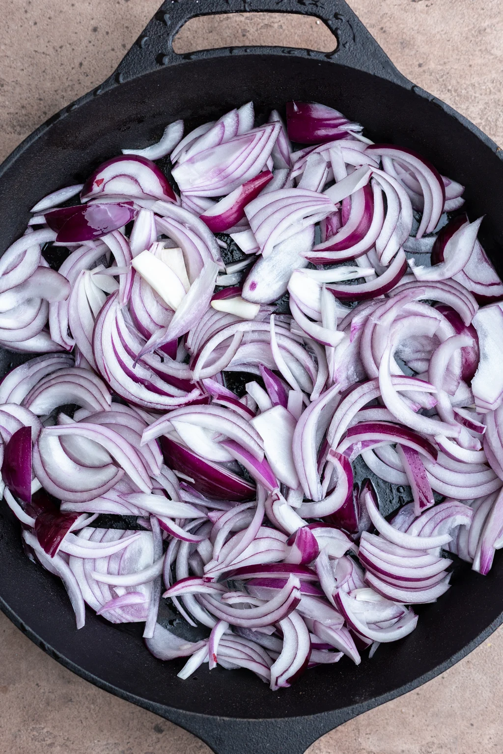 Sliced onions in pan